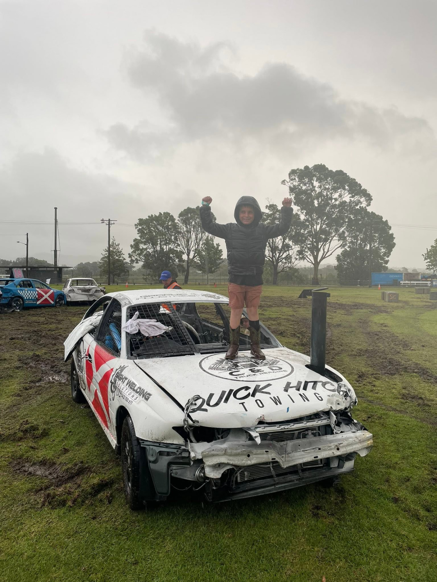 Young supporter celebrating on the bonnet of the C and D Truck Repairs derby car