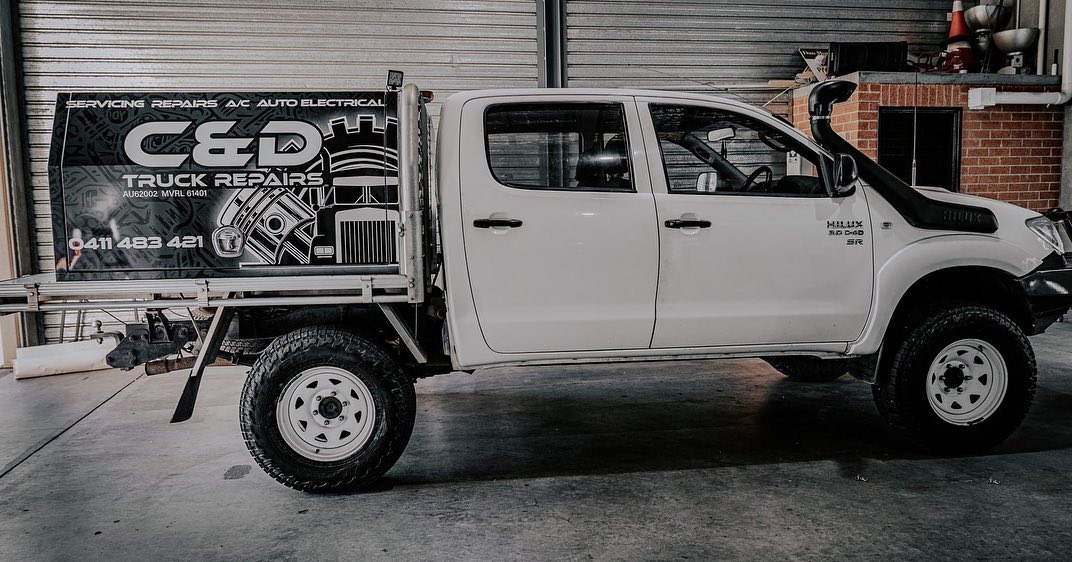 Signwritten C and D Truck Repairs service ute at the workshop